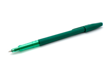 green pen on a white background
