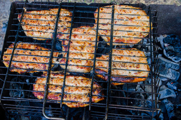 tasty, juicy meat is cooked on the grill, grilling meat