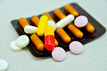 tablets are scattered on the table, dosage for the patient