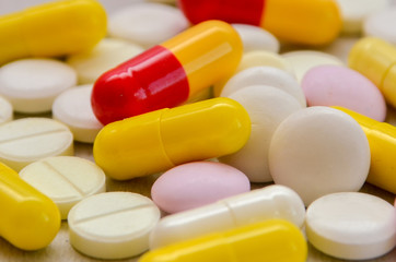 tablets are scattered on the table, dosage for the patient