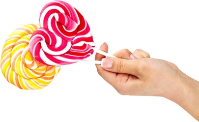 Hand Giving Lollipops - Isolated