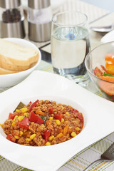 American food. Pasta alla genovese. Pasta with corn, fried meat and sauce.