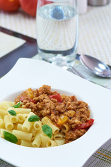 American food. Pasta alla genovese. Pasta with corn, fried meat and sauce.