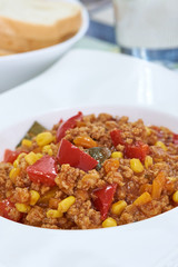 American food. Pasta alla genovese. Pasta with corn, fried meat and sauce.