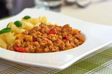 American food. Pasta alla genovese. Pasta with corn, fried meat and sauce.
