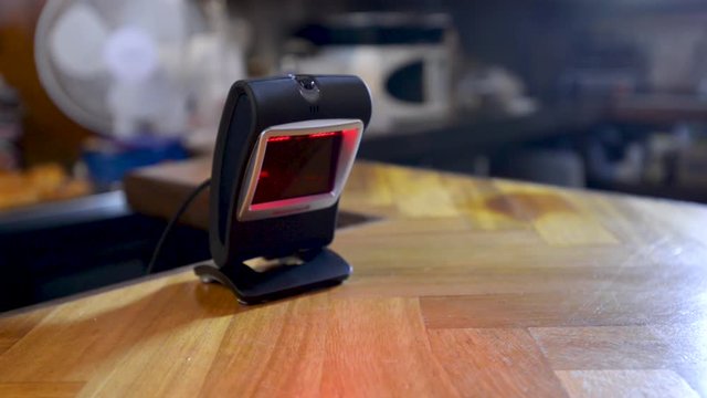 Woman Scanning a QR Code on her Phone