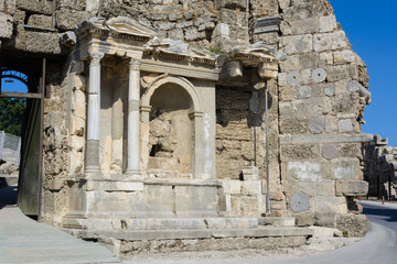 the ruins of the monument of Vespasian and Titus in the ancient city. Side, Turkey