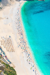 Aerial view of Myrtos beach in Kefalonia ionian island in Greece during summer in high tourist period. One of the most famous beaches in the world with turquoise crystal clear sea waters 