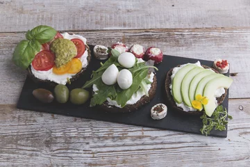 Tragetasche canape with avocado, mozzarella ,tomato,pesto,olives, cream cheese. Mix of different snacks and appetizers © koss13