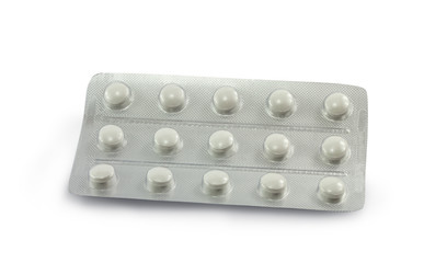 pills in the blister are isolated on a white background