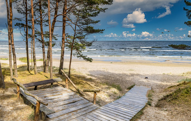 Wooden resting spot and footpath leading to a shore of the Baltic Sea, Jurmala, Latvia

