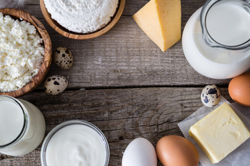 Selection of dairy products on rustic wood bacground