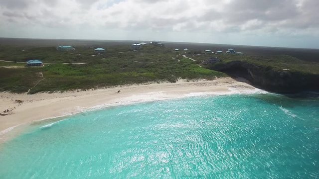 Panning aerial, coastal Turks and Caicos environment