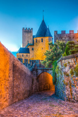 Night view over illuminated fortification of Carcassonne, France