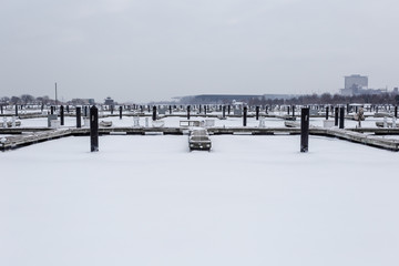 Naklejka premium Empty boat docks frozen in ice