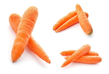 Set with fresh ripe carrots on white background