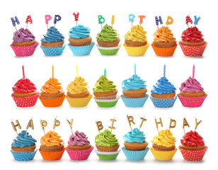 Set with birthday cupcakes and candles on white background