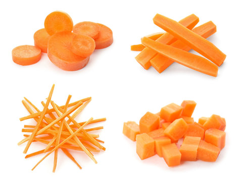 Set with ripe cut carrots on white background