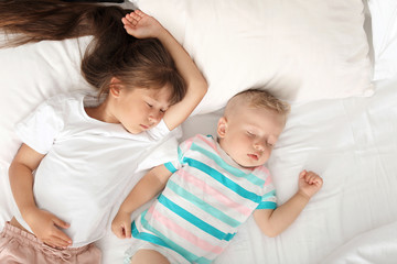 Fototapeta na wymiar Little children sleeping in bed at home