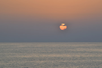 Sunrise above the Mediterranean Sea. Clud closes the sun.