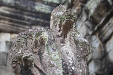 Ancient stone statue of Naga, hinduist divine creature, Banteay Samre temple, Angkor Wat, Cambodia.