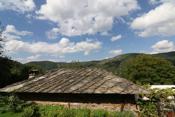 Fototapeta na wymiar Summer time of Kovachevitsa village. Stone houses, Bulgaria, Europe.
