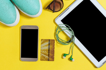 inherent accessories and devices needed for modern people everyday life. blue slip on shoes, green...