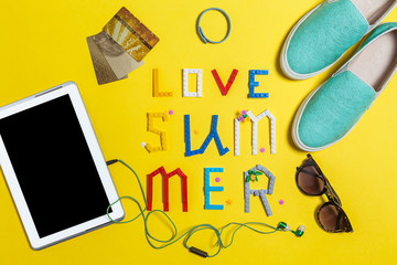 blue slip on shoes, earphones ,sunglasses ,credit card and a smartphone are surrounding word summer...