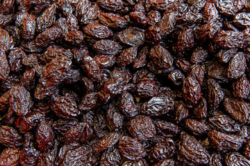 Dried plums, dried fruits in the street market. Healthy diet.