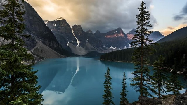 4K Time lapse film video movie of Sunrise Moraine Lake Banff National Park with reflection and golden hour.