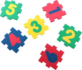 Colored puzzles with yellow numbers isolated on white background