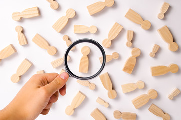 Wooden figures of people are lying on a white background. Social network. Business. The concept of...