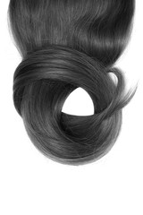 Black hair isolated on white background. Long beautiful ponytail in shape of circle