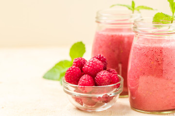 Raspberry smoothie close up photography with fresh summer blended cocktail and ripe berries.