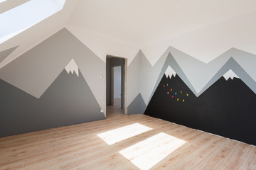 Kids bedroom with mountains paint and new laminated floor