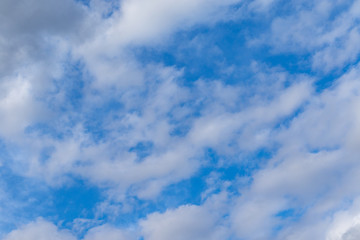 Blue sky with fluffy white clouds 