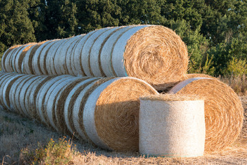 piled straw bales piled up