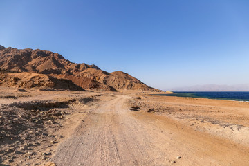 Sand road near the costline of Red Sea in Dahab. Egypt