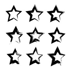Abstract black star shape textured smears set isolated on a white background