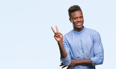Young african american business man over isolated background smiling with happy face winking at the camera doing victory sign. Number two.