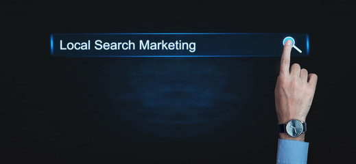Hand pressing Local Search Marketing button. Business concept