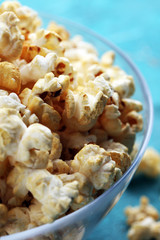 Cinema concept with popcorn on rustic table