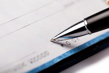 Woman's Hand Writing a Check - Close Up
