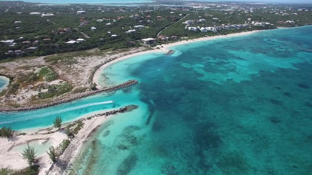 Boat leaves Turks and Caicos, aerial