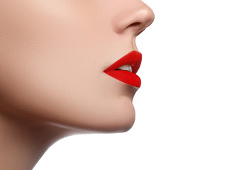 Cosmetics, makeup and trends. Bright lip gloss and lipstick on lips. Closeup of beautiful female...
