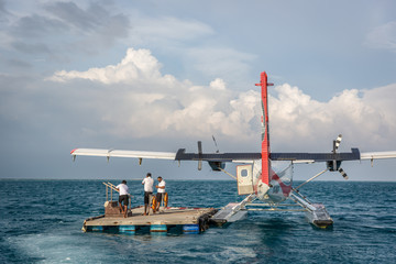 Maldives, Feb 10th 2018 - A seaplane waiting for tourists in a offshore wood platform near the...