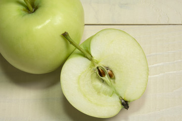 Green apple on wooden table background. Bio organic fresh fruit