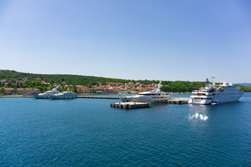 Fototapeta na wymiar Cruise port of Argostoli in Kefalonia, ionian island in Greece. A few yachts and ships are docked into the quay. The quay is mainly used for large and cruise ships