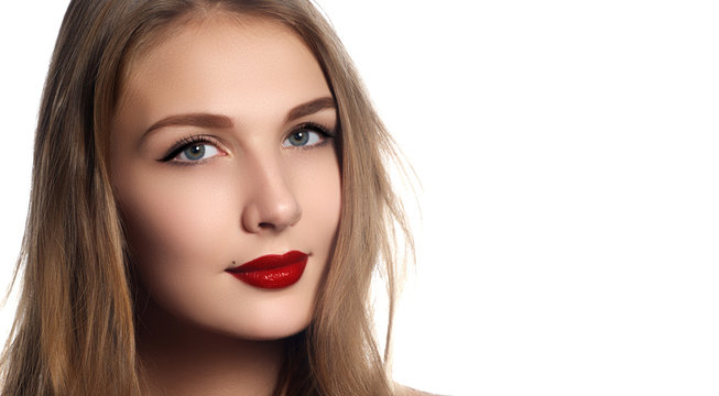 Makeup, cosmetics. Beauty young woman portrait. Beautiful model girl with beauty makeup, red lips, perfect fresh skin. Attractive lady with green eyes. Youth and Skin Care Concept