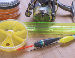 Fishing tackle on a wooden table © liga258